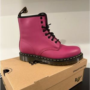 Dr. Martens Fuchsia lace up smooth boot. Size 9 or 41 in women and an 8 in men.